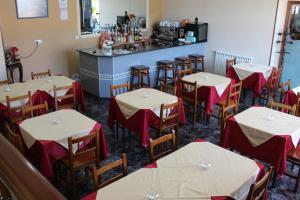 an empty dining room with tables and a bar at Hotel Fernandez in Sanxenxo