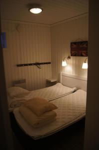 a bedroom with a bed with two pillows on it at Brostigen 5, Vemdalsskalet in Vemdalen