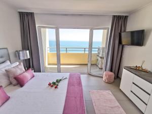 Postel nebo postele na pokoji v ubytování Apartment Jardins Rose Vista Mar