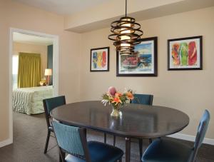 a dining room with a round table and chairs at Worldmark Oceanside Harbor in Oceanside