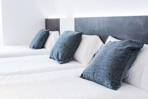 Posteľ alebo postele v izbe v ubytovaní Hostal Ribas