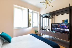 Posteľ alebo postele v izbe v ubytovaní Milano Manzoni CLC Apartments