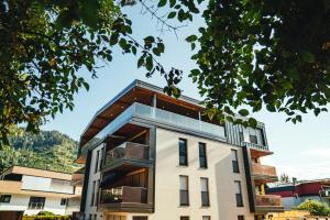 a building with glass windows on top of it at Deluxe Apartment Berglust in Schladming
