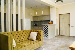 a living room with a couch in a kitchen at CHALET DILIJAN VILLAS in Dilijan