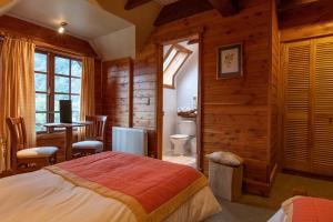 Postel nebo postele na pokoji v ubytování Petrohue Lodge