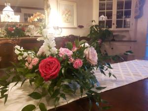 a bouquet of flowers in a vase on a table at Historic Wilson-Guy House in Niagara-on-the-Lake