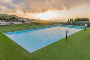 an overhead view of a swimming pool in a yard at Casa de Campo, Algarvia in Algarvia