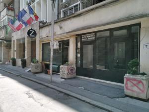 an empty street in front of a building at Premium Studio by MRG Apartments in Bucharest