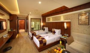 Postel nebo postele na pokoji v ubytování Amber Dale Luxury Hotel & Spa, Munnar