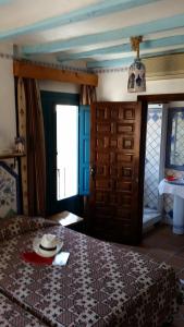 Postel nebo postele na pokoji v ubytování Hostal la Ninfa