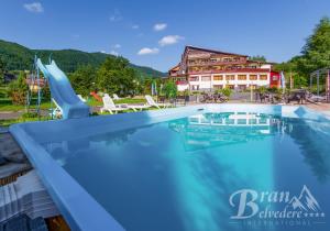 a view of the swimming pool at the resort at Bran Belvedere International in Bran