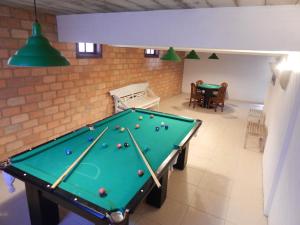 a billiard room with a pool table in it at Pousada Jataí in Cabo Frio