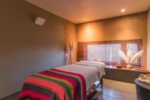 Ένα ή περισσότερα κρεβάτια σε δωμάτιο στο Hotel Cumbres San Pedro de Atacama
