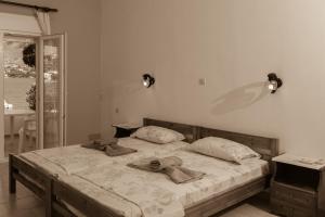 A bed or beds in a room at Olga Apartments
