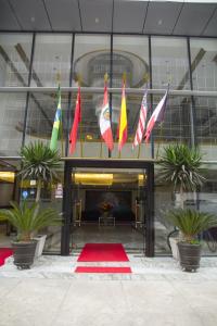 a group of flags in front of a building at Swan Hotel in Lima