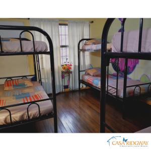 เตียงสองชั้นในห้องที่ Hostel Casa Ridgway