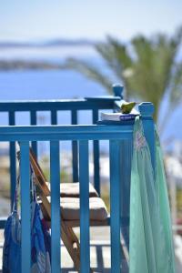 a blue table with two bags on top of it at Hotel Nazos in Mikonos