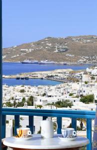 a view from a balcony overlooking the ocean at Hotel Nazos in Mikonos