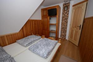 Lova arba lovos apgyvendinimo įstaigoje Apartament Folk&Dream Harenda Zakopane