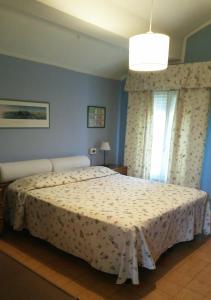 Postel nebo postele na pokoji v ubytování Corte Posta B&B - parcheggio e bagno in camera