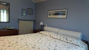 Postel nebo postele na pokoji v ubytování Corte Posta B&B - parcheggio e bagno in camera
