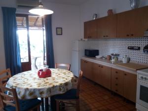 a kitchen with a table with a red bowl on it at Terrazza sul Mare in Lipari +44 photos