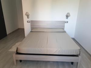 a bed in a small room with at Civico36 in Passignano sul Trasimeno