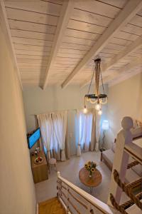 a living room with a couch and a table at Archontissa House in the Old Town in Rethymno Town