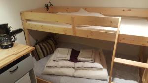 a bedroom with two bunk beds in a room at Sollyan in Knivsta