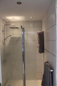 a shower with a glass door in a bathroom at Casa Romantica de Balcon de Amadores in Amadores