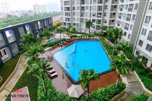 an overhead view of a swimming pool in a building at MRT Apartment In Masteri Thao Dien in Ho Chi Minh City