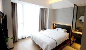 Voodi või voodid majutusasutuse Hangzhou Yuqi Hotel - West Lake Scenic Area Branch toas