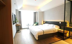 Voodi või voodid majutusasutuse Hangzhou Yuqi Hotel - West Lake Scenic Area Branch toas