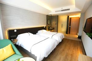 Voodi või voodid majutusasutuse Hangzhou Yuqi Hotel - West Lake Scenic Area Branch toas