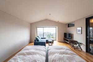 TV o dispositivi per l'intrattenimento presso the salon 伊豆高原 Hotels & Resort