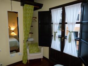 A bed or beds in a room at Mayorazgo De Altamira Mila