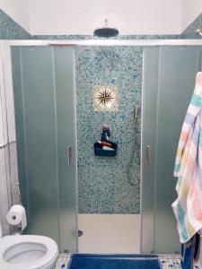 a bathroom with a shower with a toilet at Terrazza sul Mare in Lipari