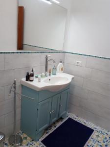 a bathroom with a sink and a mirror at Terrazza sul Mare in Lipari