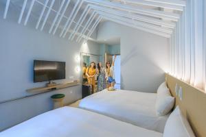 Katil atau katil-katil dalam bilik di HOTEL PIN Jiaoxi