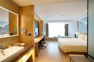 Postel nebo postele na pokoji v ubytování Atour Hotel Guangzhou Yueqiao Branch