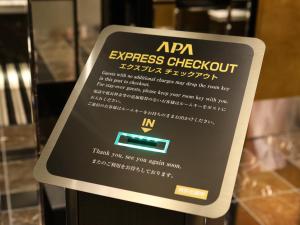 a sign in a display case in a store at APA Hotel & Resort Yokohama Bay Tower in Yokohama