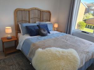 A bed or beds in a room at Play@PortMacq