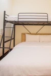 Ένα ή περισσότερα κρεβάτια σε δωμάτιο στο Douzi Hotel-Xpark. Gloria Outlets. Taoyuan MRT