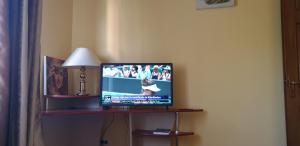 a television sitting on a table in a room at Exclusive HORTENSIEI in Baia Mare