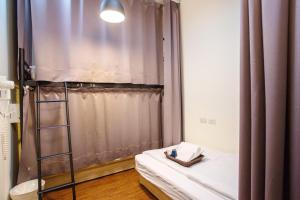 Ένα ή περισσότερα κρεβάτια σε δωμάτιο στο Douzi Hotel-Xpark. Gloria Outlets. Taoyuan MRT