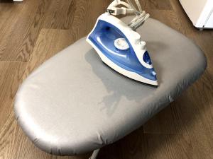 a blue and white phone sitting on top of a chair at 板橋 RCアネックス Rc206 in Tokyo