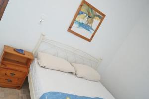 A bed or beds in a room at Kolona Studios