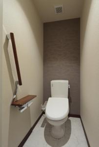 a bathroom with a white toilet in a room at HOTEL PROMOTE HIROSHIMA in Hiroshima +40 photos