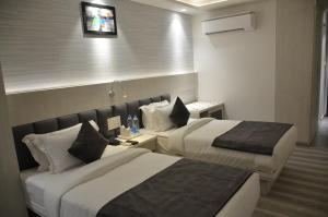 Krevet ili kreveti u jedinici u okviru objekta Hotel Radiance