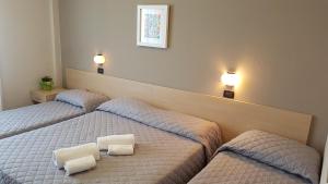 Postel nebo postele na pokoji v ubytování Hotel Excelsior